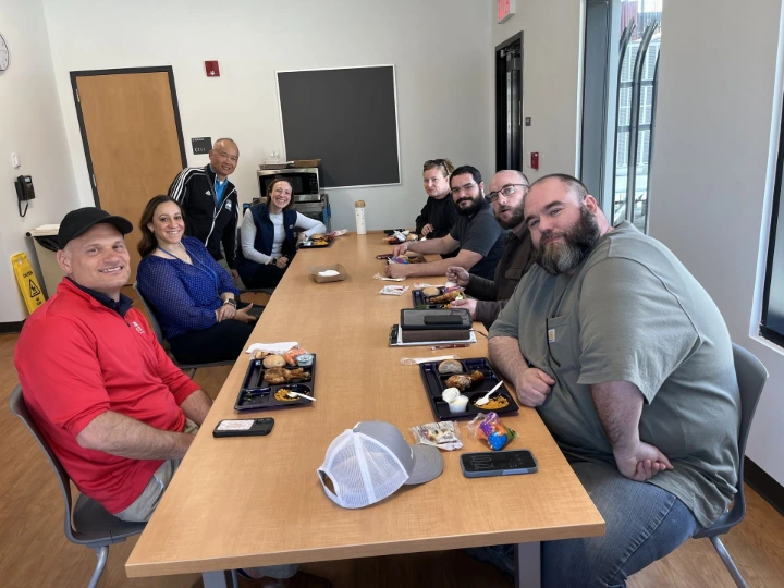 Steadfast Farms team and Connecticut farm partners eating school lunch during a Hartford Public Schools farm-to-cafeteria field trip.